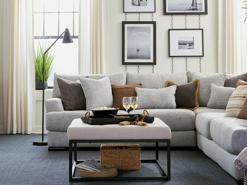 Modern living room with grey sofa and gallery wall